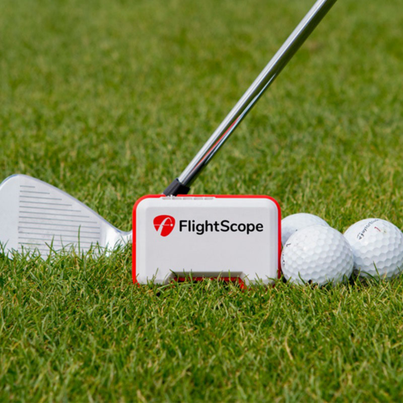 Mevo unit with club and golf balls