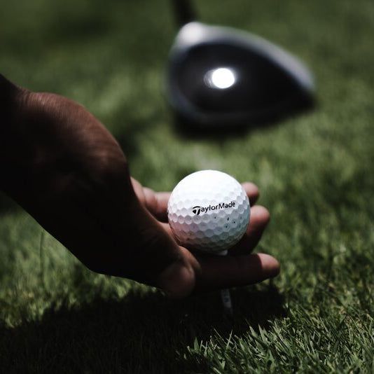 hand holding a golf ball