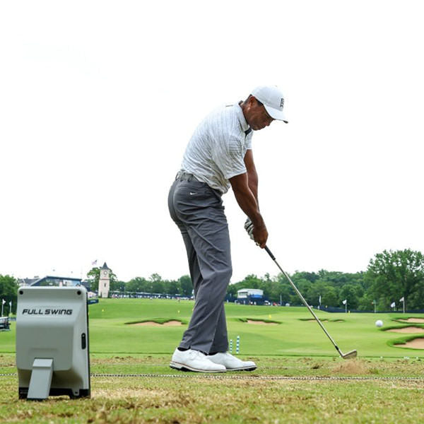 Full Swing KIT Launch Monitor Rear View Showing A Man Playing Golf